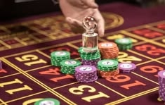 J10Game casino presented on mobile device in Pakistan with slots and live games